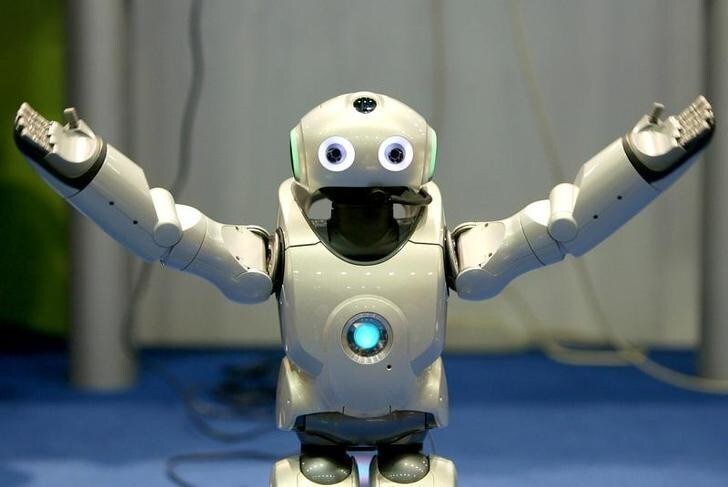 A robot gestures during a demonstration of its skill during the seventh Soccer World Championship for Robots in Padua, northern Italy, July 9, 2003. Robocup is an international research and education initiative aimed at fostering artificial intelligence and robotics research.