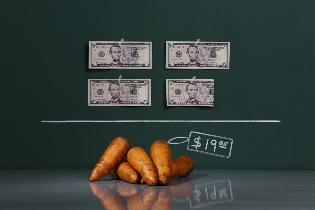 A kilogram (2.2 lbs) of raw carrots as photographed in a studio with an illustrative price tag. Picture taken September 29, 2014.