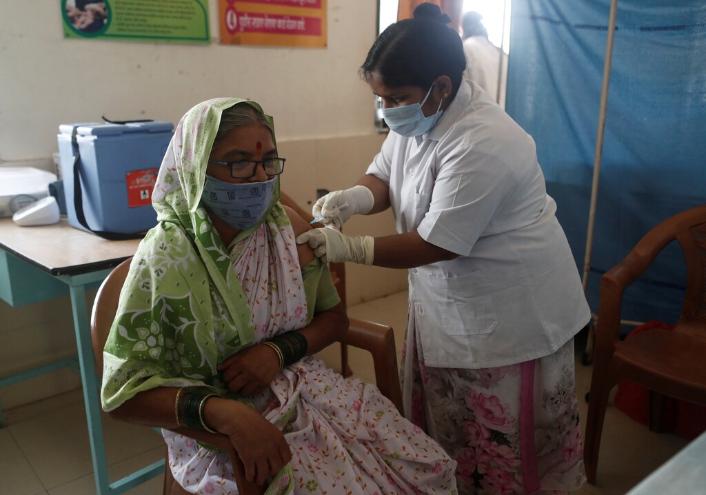 Kamal Sanas, a 56-year old sugarcane grower, receives a dose of COVISHIELD coronavirus disease (COVID-19) vaccine manufactured by Serum Institute of India, at a primary healthcare centre in Limb village in Satara district in the western state of Maharashtra, India, March 24, 2021. Picture taken March 24, 2021. REUTERS/Francis Mascarenhas - RC2DLM99RQOM