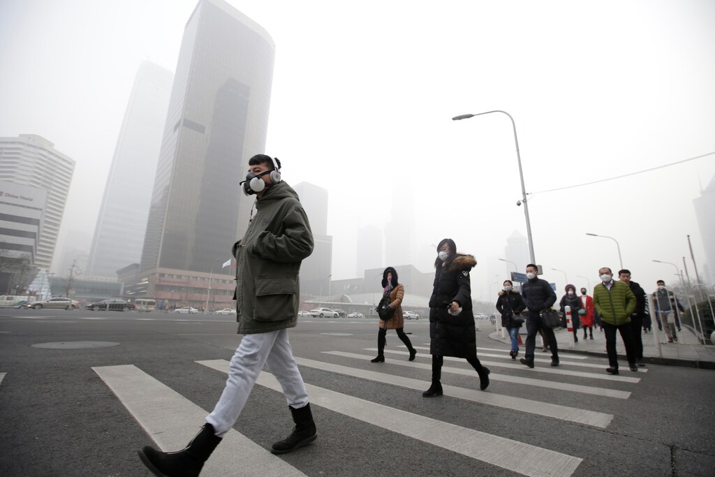 Time to hit the omega-3 … Beijing citizens wearing respiratory masks during a smog alert, December 2016.