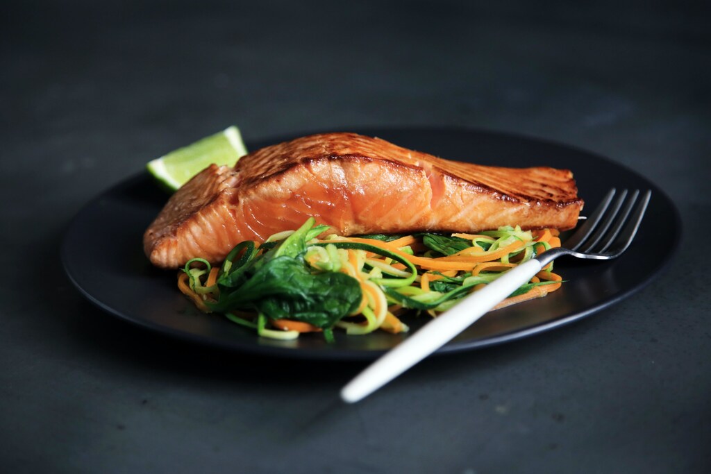 Cooked salmon with vegetables on a plate. Nordic diet Mediterranean diet traditional food