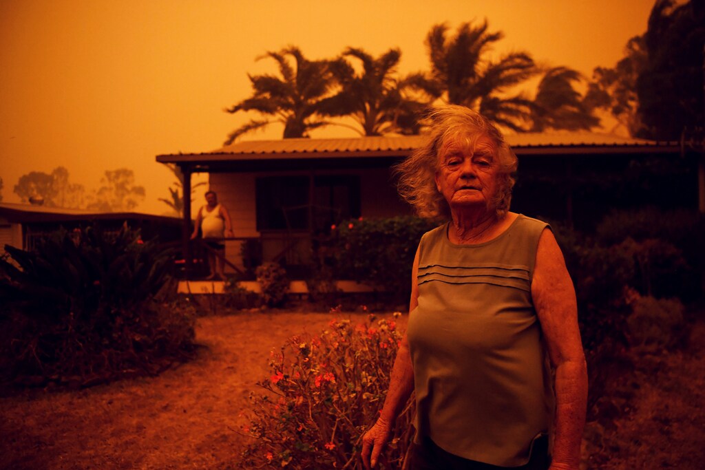 Nancy Allen and Brian Allen stand outside the house as high winds push smoke and ash from the Currowan Fire towards Nowra, New South Wales, Australia January 4, 2020. REUTERS/Tracey Nearmy TPX IMAGES OF THE DAY - RC219E9IA30G