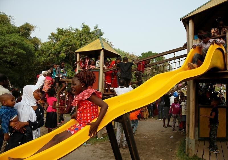 Children enjoy the slide at a playground during the New Year's Day celebrations at the Millennium park in Abuja, Nigeria January 1, 2018.