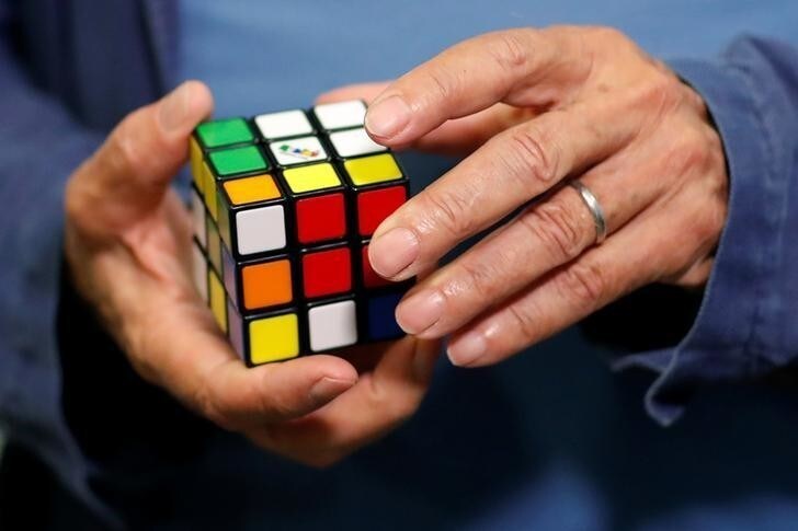 Erno Rubik, the creator of the puzzle, solves a Rubik's cube as he poses during the world's largest Rubik's Cube championship in Aubervilliers, near Paris, France, July 15, 2017. REUTERS/Stephane Mahe