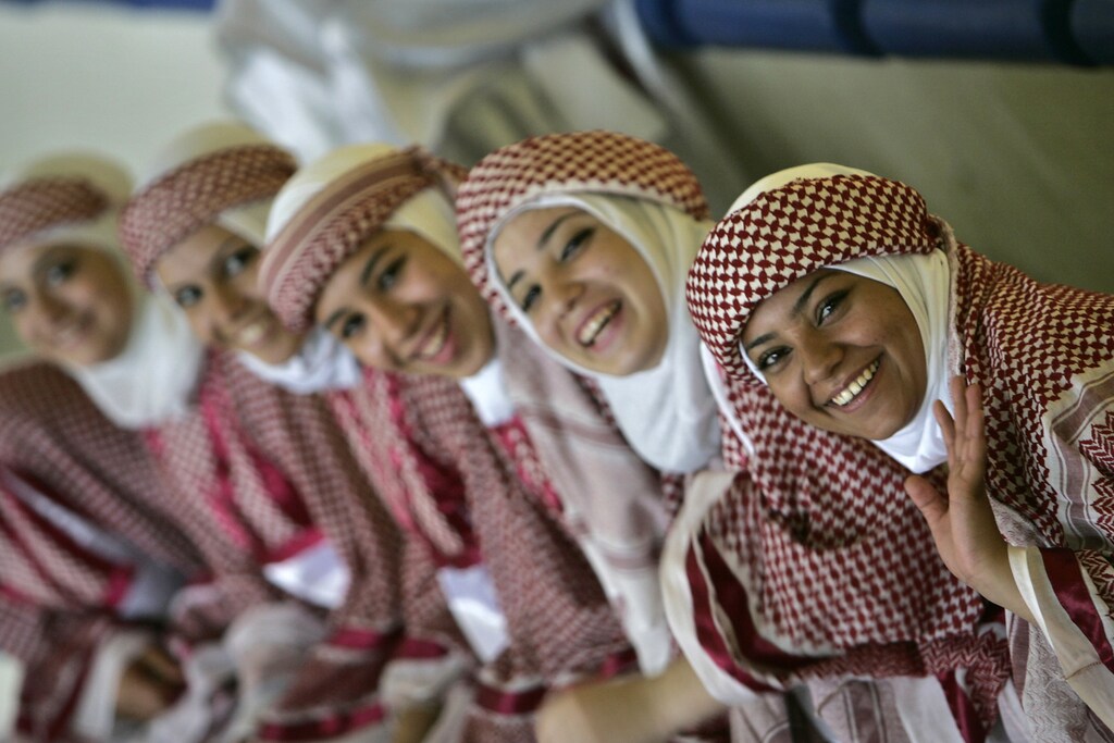 Jordanian students in traditional costume take part in activities as part of the "King Abdullah II Award for Physical Fitness" project at Tlaa' Al-Ali High School sports complex in Amman October 22, 2008