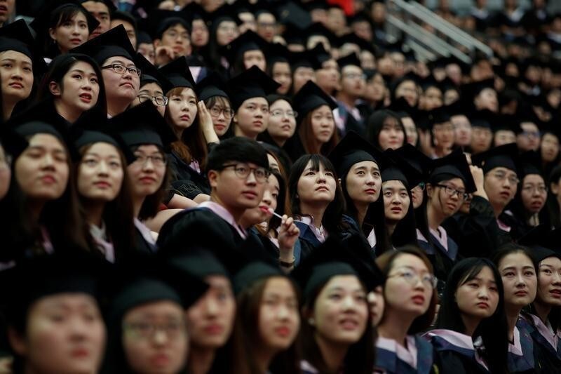 Students attend a graduation ceremony at Fudan University in Shanghai, China June 23, 2017. REUTERS/Aly Song - RC19CFDDFF20