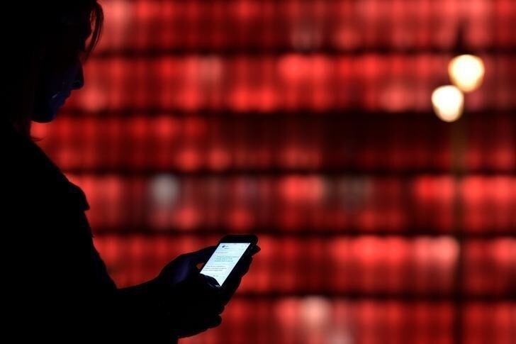 A woman holding a smartphone