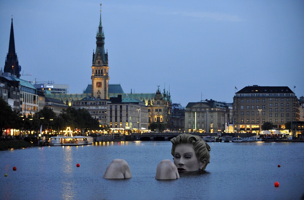 A 'mermaid' sculpture created by Oliver Voss is seen in the late evening hours on Alster lake in Hamburg August 3, 2011.