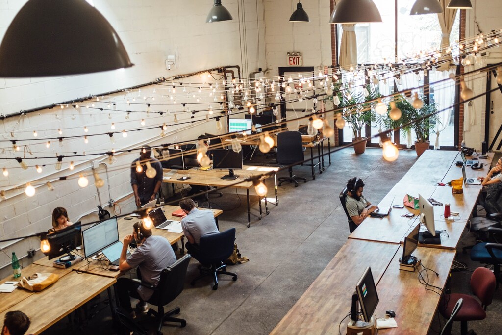 People seating in front of computer monitors at Bat Haus Coworking and Event Space, United States