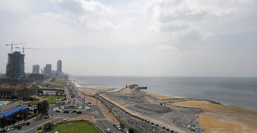 A general view of the "Colombo Port City" construction site (R), backed by Chinese investment, is seen in Colombo, Sri Lanka January 14, 2016. Sri Lanka is to go ahead with a $1.4 billion Chinese-backed real estate project after some changes to its terms, a minister said on Tuesday, signalling readiness to accept more Chinese investment in the face of a balance-of-payment crisis.