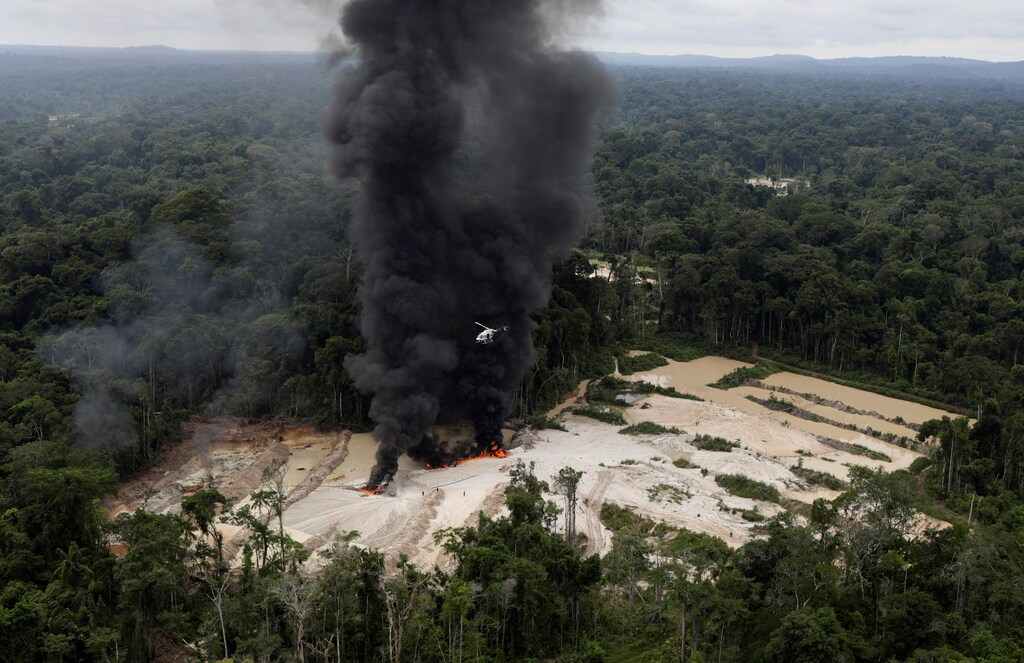 Machines are destroyed at an illegal gold mine during an operation conducted by agents of the Brazilian Institute for the Environment and Renewable Natural Resources, or Ibama, in national parks near Novo Progresso, southeast of Para state, Brazil, November 5, 2018. REUTERS/Ricardo Moraes SEARCH "IBAMA MORAES" FOR THIS STORY. SEARCH "WIDER IMAGE" FOR ALL STORIES. TPX IMAGES OF THE DAY. - RC1ECE51CB90