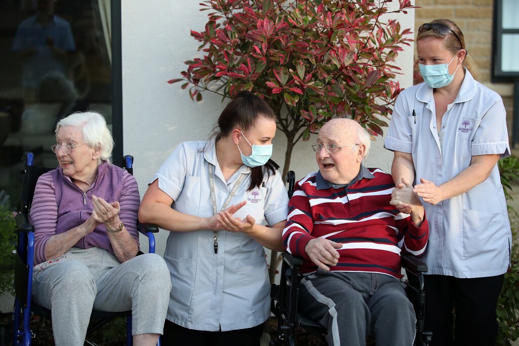 Care workers and residents of the Scisset Mount Care Home react during the last day of the Clap for our Carers campaign in support of the NHS, following the outbreak of the coronavirus disease (COVID-19), Huddersfield, Britain, May 28, 2020