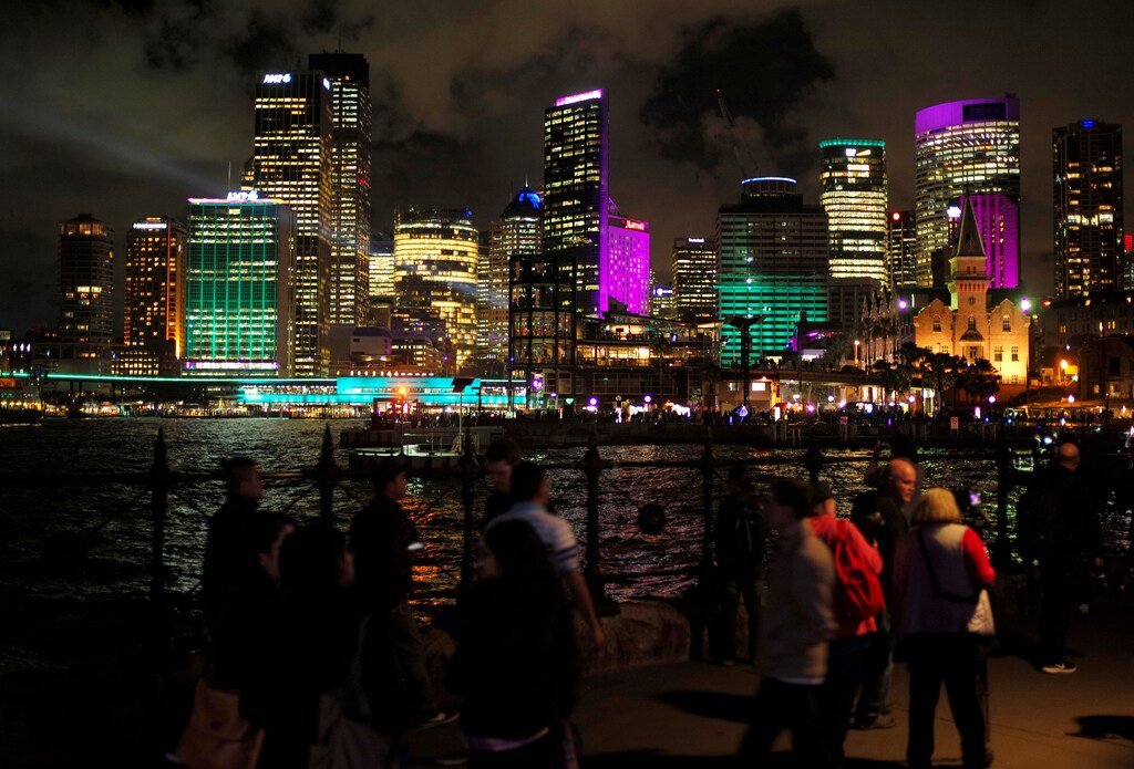 Office building are lit with colorful projections of light on the first night of the Sydney Vivid Festival light and sound show in Sydney, Australia May 26, 2017. REUTERS/Jason Reed - RC138B916330