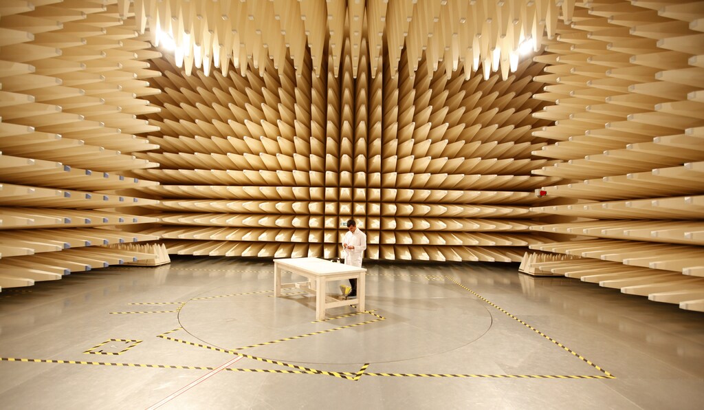 A technician examines a mobile phone in a test room at the Market Surveilance Laboratories of the Information and Communication Technologies Authority of Turkey, in Ankara June 9, 2011. Founded in 2007 with funds from the European Union, the facility, comprising of five different labs, tests mobile telephones and other communication devices to determine their Specific Absorbition Rate (SAR) value. SAR is a measurement of how much electromagnetic radiation is absorbed by body tissue whilst using a mobile phone. REUTERS/Umit Bektas (TURKEY - Tags: BUSINESS HEALTH) - LR2E76918880C