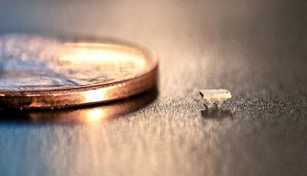 A micro-bristle-bot next to a US penny for scale. (Credit: Allison Carter/Georgia Tech)
