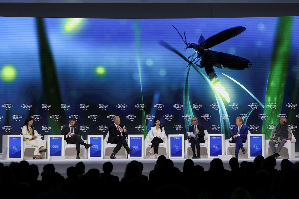 Former U.S. Vice-President Al Gore, Spanish Prime Minister Pedro Sanchez and Bangladesh's interim leader Muhammad Yunus attend the 55th annual World Economic Forum (WEF) meeting in Davos, Switzerland, January 22, 2025. REUTERS/Yves Herman; climate change
