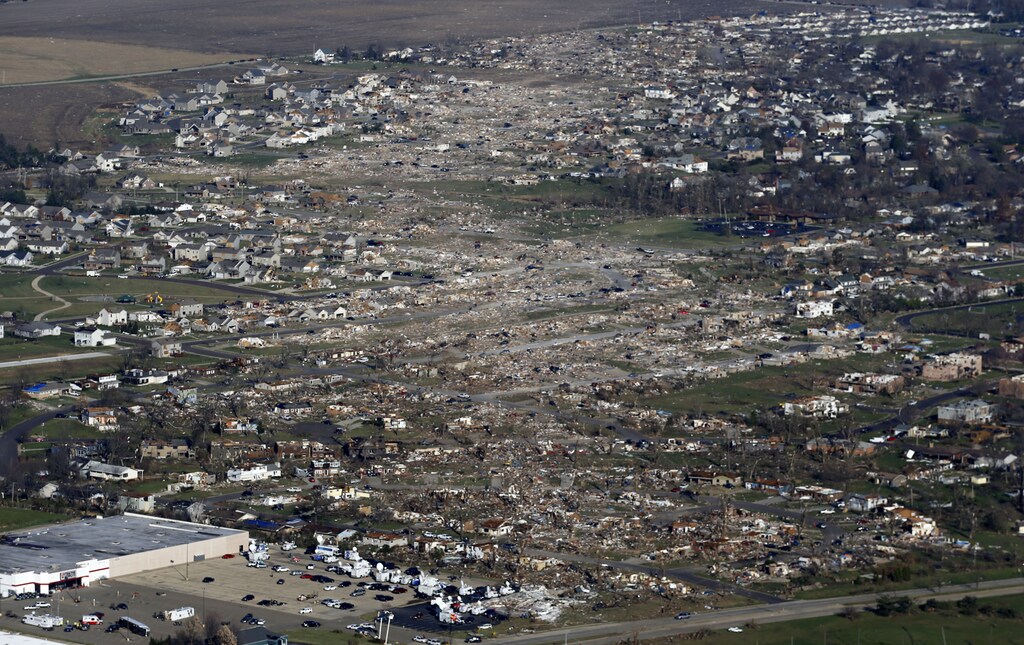 An aerial view shows the path of destruction caused by a tornado that touched down in Washington, Illinois, November 18, 2013. A fast-moving storm system triggered multiple tornadoes on Sunday that killed at least six people and flattened large parts of a town in Illinois as it tore across the Midwest, authorities said. REUTERS/Jim Young (UNITED STATES - Tags: DISASTER ENVIRONMENT TPX IMAGES OF THE DAY) - GM1E9BJ0EK201