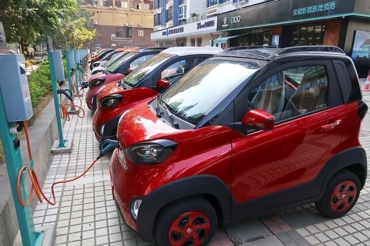 Baojun E100 all-electric battery cars are seen while they are being charged in the parking lot in front of a Baojun NEV Experience Center store in Liuzhou, Guangxi Zhuang Autonomous Region, China, November 8, 2017. Picture taken November 8, 2017. REUTERS/Norihiko Shirouzu