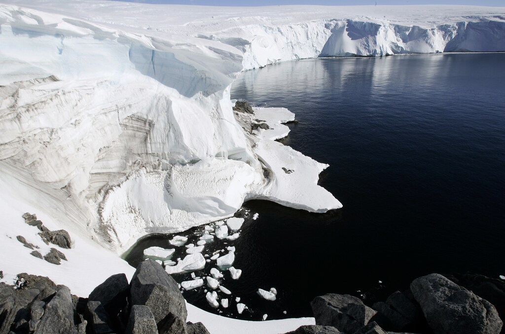 Melting ice shows through at a cliff face at Landsend, on the coast of Cape Denison in Antarctica December 12, 2009. Russia and the Ukraine on November 1, 2013 again scuttled plans to create the world's largest ocean sanctuary in Antarctica, pristine waters rich in energy and species such as whales, penguins and vast stocks of fish, an environmentalist group said. The Commission for the Conservation of Antarctic Marine Living Resources wound up a week-long meeting in Hobart, Australia, considering proposals for two "marine protected areas" aimed at conserving the ocean wilderness from fishing, drilling for oil and other industrial interests. Picture taken December 12, 2009. To match story ANTARCTIC-ENVIRONMENT/ REUTERS/Pauline Askin (ANTARCTICA - Tags: ENVIRONMENT POLITICS) - RTX14WB4