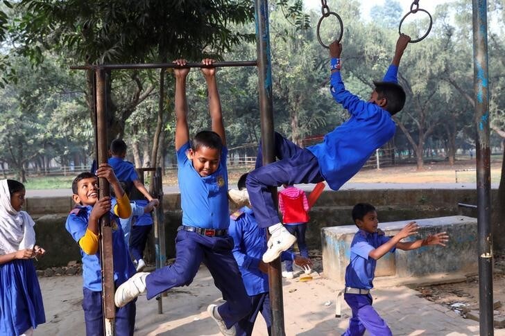 Children in school uniforms play at a park in Dhaka, Bangladesh, December 18, 2019. REUTERS/Mohammad Ponir Hossain