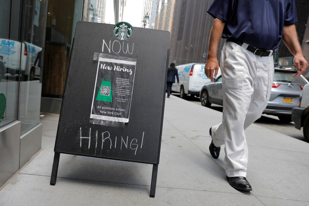 A sign advertising job openings is seen outside of a Starbucks in Manhattan, New York City, New York, U.S., May 26, 2021. REUTERS/Andrew Kelly - RC2SNN93868V
