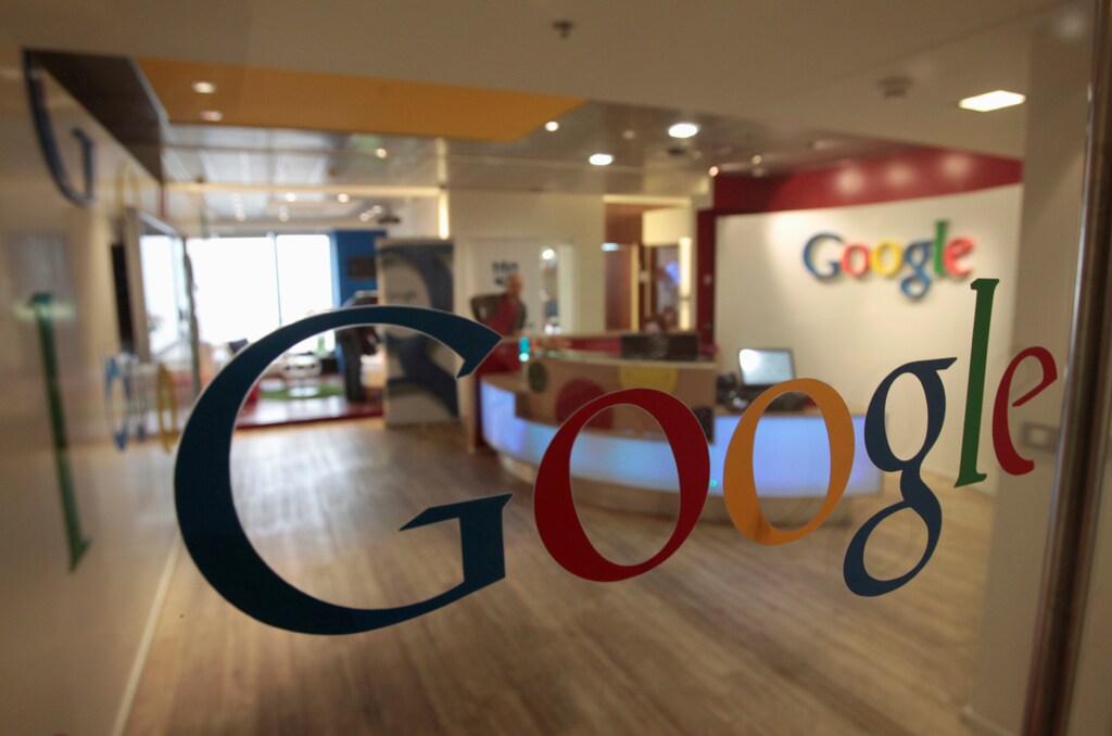The Google logo is seen on a door at the company's office in Tel Aviv January 26, 2011. REUTERS/Baz Ratner/File Photo - RTX2JM6K