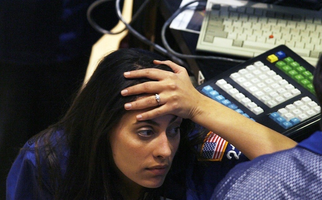 A trader reacts after the closing bell of the New York Stock Exchange on November 5, 2008. U.S. stocks plummeted on Wednesday, a day after Barack Obama's historic victory in the U.S. presidential election, as a fresh batch of dismal economic data underscored the massive challenges awaiting his administration.