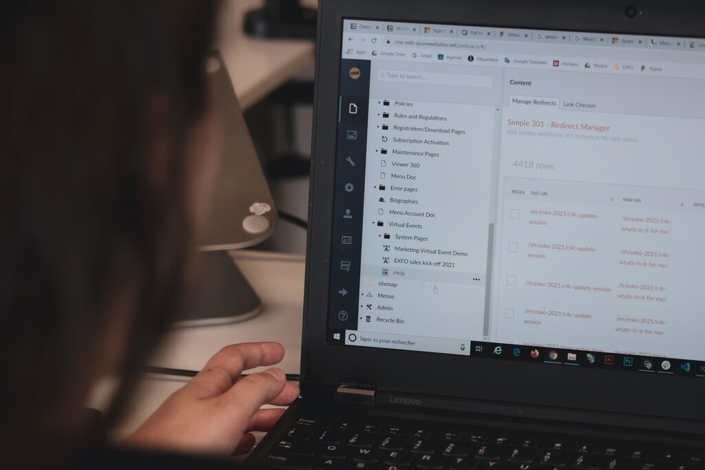 person working at laptop computer showing how cybersecurity is a risk