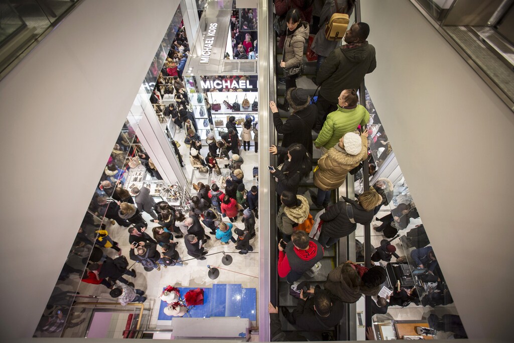 Shoppers enter Macy's to kick off Black Friday sales in New York November 27, 2014.