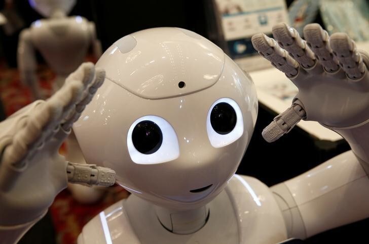 SoftBank humanoid robot known as Pepper moves its hands at Pepper World 2016 Summer during SoftBank World 2016 conference in Tokyo, Japan, July 21, 2016. REUTERS/Kim Kyung-Hoon