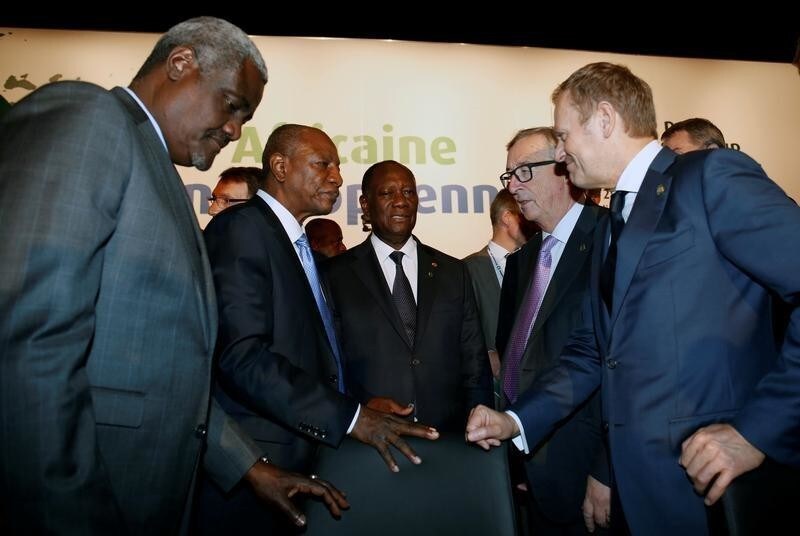 African Union Commission President Moussa Faki Mahamat, Guinea's President and President of the African Union Alpha Conde, Ivory Coast's President Alassane Ouattara, President of the European Commission Jean-Claude Juncker and European Council President Donald Tusk talk during the closing session of the 5th African Union - European Union (AU-EU) summit in Abidjan, Ivory Coast November 30, 2017. REUTERS/Luc Gnago - RC16934D4E00