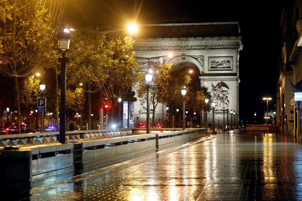 A deserted Champs-Elysees avenue is seen near the Arc de Triomphe in france during the covid curfew lockdown