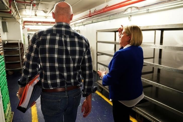 Ontario NDP Leader Andrea Horwath and Michael Balagus depart from a kitchen during a campaign rally in Toronto, Ontario, Canada, June 3, 2018. REUTERS/Carlo Allegri