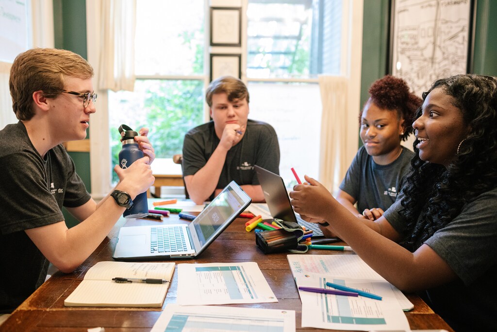 Robert, David, Annika, and Ta’Mya—members of the NW Louisiana Teen Advisory Committee (TAC)—prepare to present data and policy recommendations to local civic, education, and nonprofit leaders about the mental wellbeing challenges faced by young people in the region. The TAC is an initiative of LEAPS, a BHP-supported program launched by IYF to make space for teens to identify and raise issues and find solutions within their community.