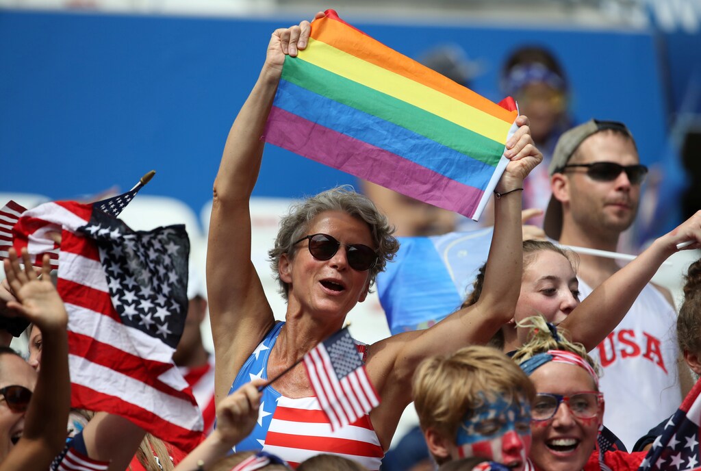 Soccer Football - Women's World Cup Final - United States v Netherlands - Groupama Stadium, Lyon, France - July 7, 2019 United States fans with a rainbow Pride flag inside the stadium before the match REUTERS/Denis Balibouse - RC14D31891D0