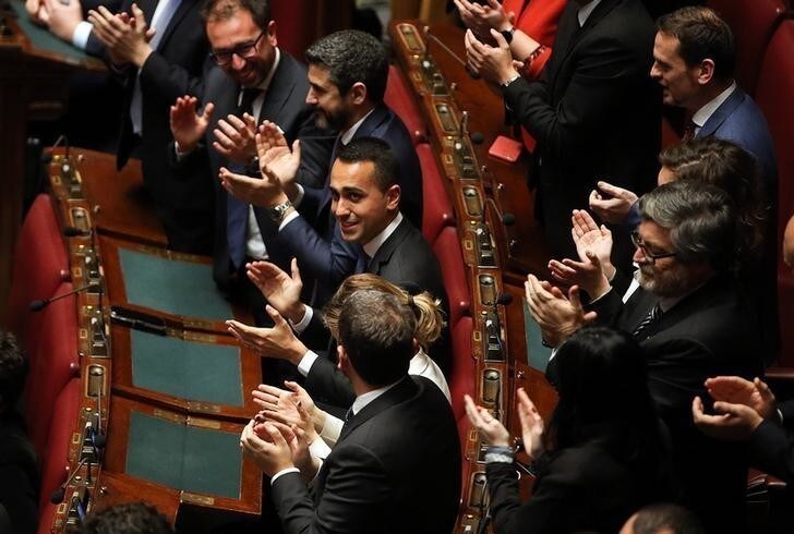 Five Stars Movement (M5S) leader Luigi Di Maio applauses the new Chamber of Deputies president Roberto Fico during the second session day since the March 4 national election in Rome, Italy March 24, 2018. REUTERS/Tony Gentile