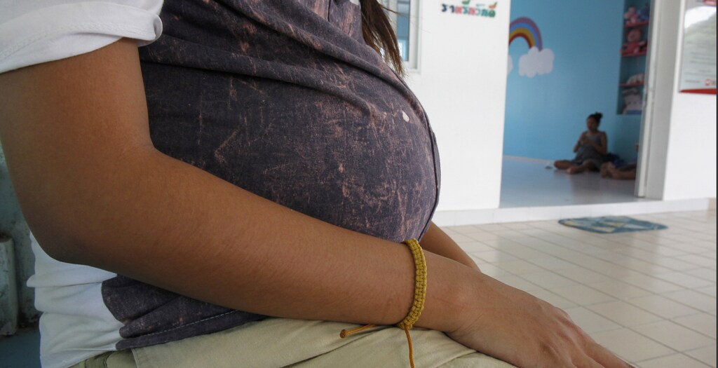 An unnamed 18-year-old teenager, who is eight months pregnant, rests outside her room at the Association for the Promotion of the Status of Women in Bangkok March 7, 2013. Thailand's teenage pregnancy rate is the highest in Southeast Asia after neighbouring Laos, according to the Bureau of Reproductive Health at the Thai Public Health Ministry.
