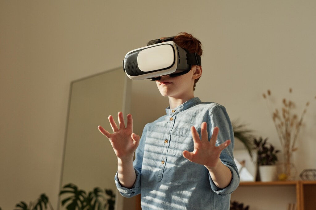 Digital divide: boy wears VR headset.