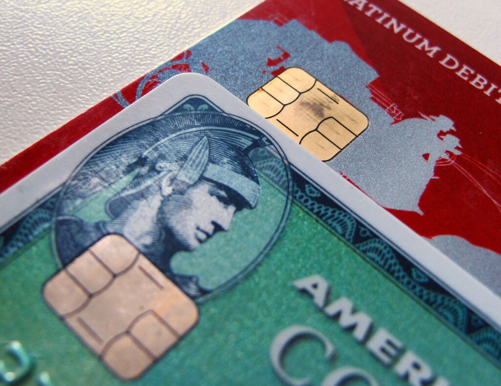 Computer chips are seen on newly-issued credit cards in this photo illustration taken in Encinitas, California September 28, 2015. In an effort to reduce counterfeit and credit card fraud more than 200 million payment cards have been issued with embedded computer chips in the U.S., ahead of a Oct. 1 deadline for the switch to such cards, according to the Smart Card Alliance. Credit card companies have set the October deadline which will require U.S. consumers to carry a new kind of card and retailers across the nation to upgrade payment terminals. REUTERS/Mike Blake - GF10000225781