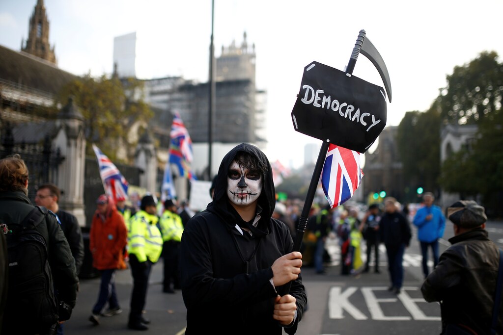 A protester poses for a picture outside the Parliament in Westminster, London, Britain October 31, 2019.