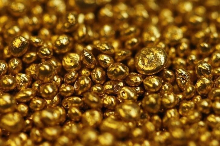 Gold granulate is seen at a plant of gold refiner and bar manufacturer Valcambi SA in the southern Swiss town of Balerna December 20, 2012. Picture taken December 20, 2012. To match story SWISS-GOLD/ REUTERS/Michael Buholzer (SWITZERLAND - Tags: BUSINESS)