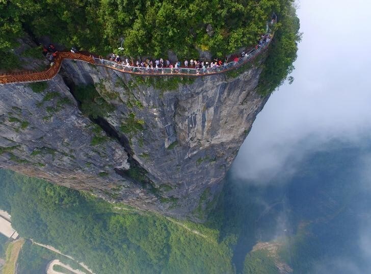 Tourists explore a sightseeing platform in Zhangjiajie, Hunan Province, China, REUTERS/Stringer