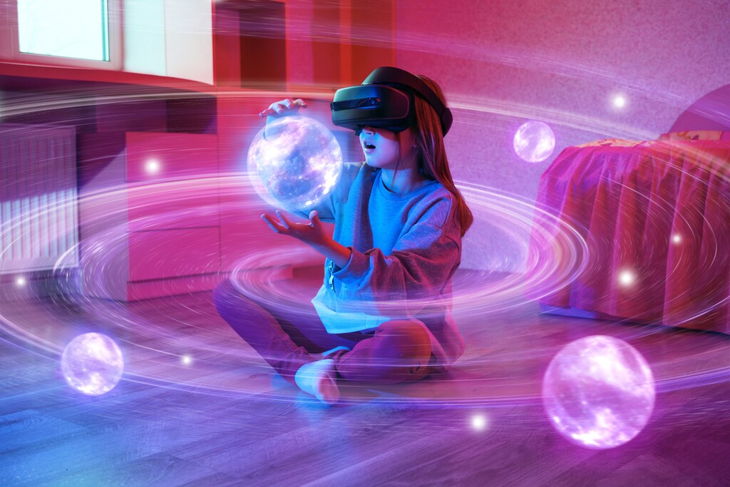Girl holds virtual planet between her hands with virtual reality (VR) set: Experiential learning can be delivered by VR.