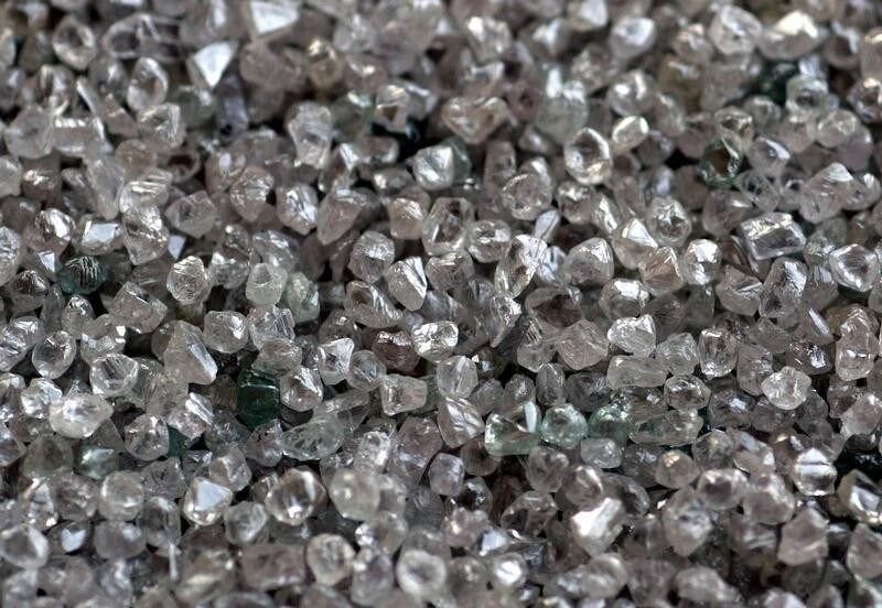 Rough diamonds during their sorting process are seen at the Botswana Diamond Valuing Company in Gaborone. NO RIGHTS CLEARANCES OR PERMISSIONS ARE REQUIRED FOR THIS IMAGE Rough diamonds during their sorting process are seen at the Botswana Diamond Valuing Company in Gaborone August 26, 2004. Botswana's diamond output has been hit by a strike this week at miner Debswana, but the nation's production target of up to 30 million carats a year can still be achieved, a government minister said on Thursday. REUTERS/Juda Ngwenya - RP5DRHXXVJAC