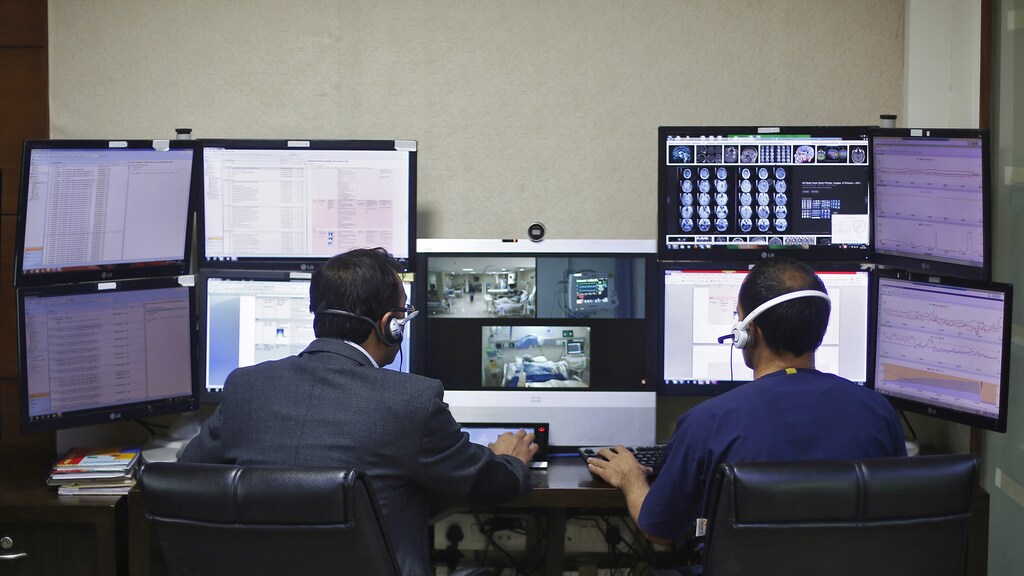 Doctors remotely monitor live footages of patients inside an electronic intensive care unit (eICU) at Fortis hospital in New Delhi, India, January 20, 2016.