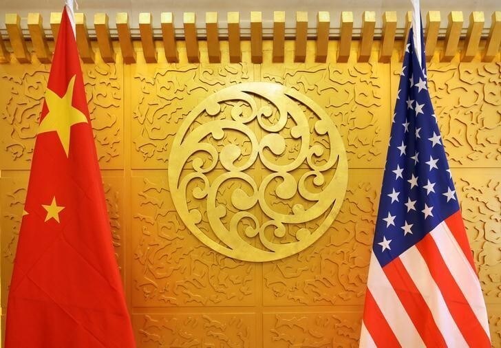 Chinese and U.S. flags are set up for a meeting during a visit by U.S. Secretary of Transportation Elaine Chao at China's Ministry of Transport in Beijing, China April 27, 2018. Picture taken April 27, 2018. REUTERS/Jason Lee