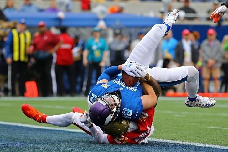 Jan 28, 2018; Orlando, FL, USA; Minnesota Vikings wide receiver Adam Thielen (19) scores a touchdown against Jacksonville Jaguars cornerback A. J. Bouye (21) in the first half in the 2018 NFL Pro Bowl at Camping World Stadium. Mandatory Credit: Aaron Doster-USA TODAY Sports
