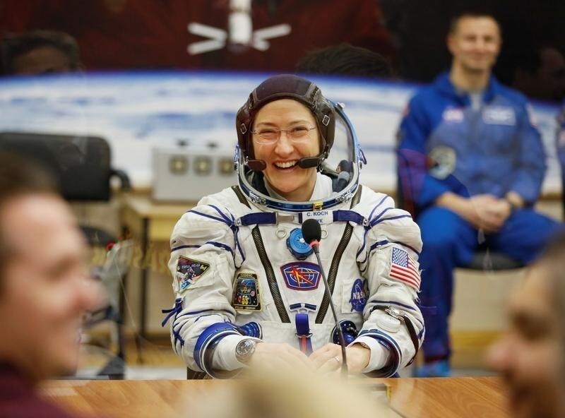 The International Space Station (ISS) crew member Christina Koch of the U.S. smiles after donning space suit check shortly before launch at the Baikonur Cosmodrome, Kazakhstan March 14, 2019. REUTERS/Shamil Zhumatov - RC17AE9D01A0