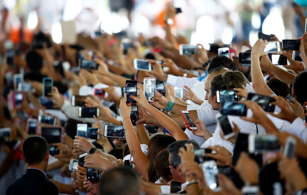 The faithful use mobile phones as Pope Francis arrives at the National Reconciliation Encounter at "Las Malocas Park" in Villavicencio, Colombia September 8, 2017.