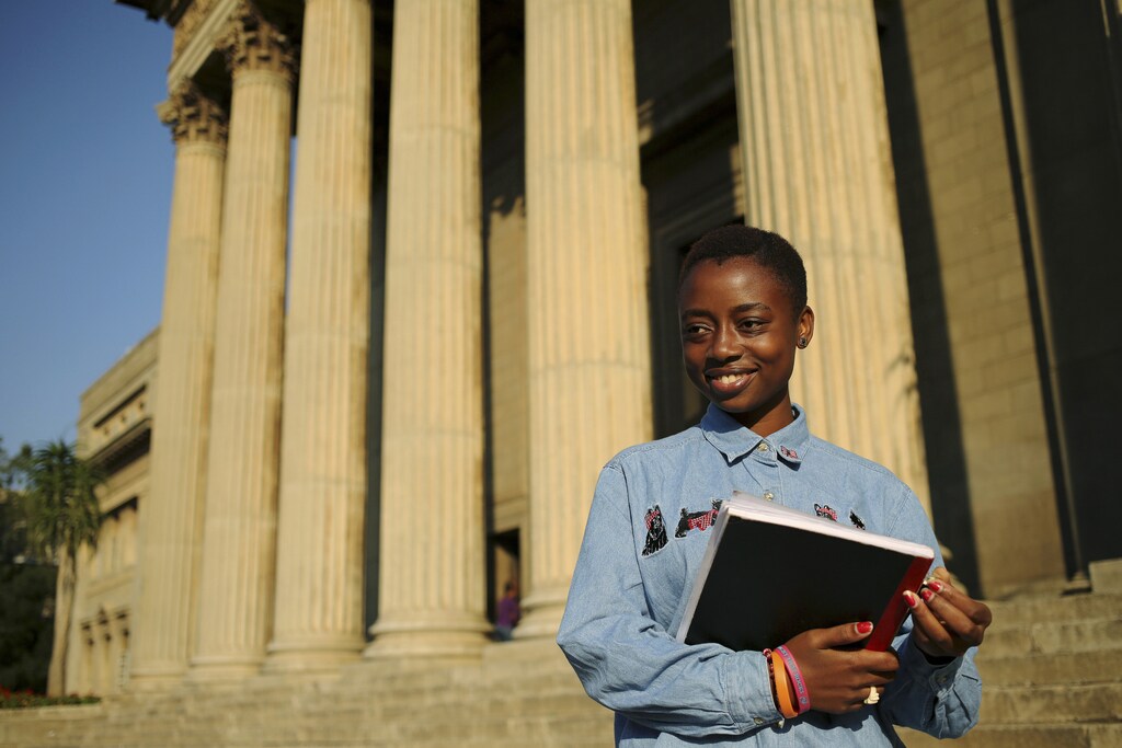 Second-year civil engineering student and first-time voter Nkululeko Simelane poses for a picture at Wits University in Johannesburg, April 22, 2014. Nkululeko said "For me voting for the first time... I don't want to lie I don't have the energy. The only thing that is pushing me to vote is that it is for the first time I don't want to miss it". Around 20 million South Africans - or some 40 percent of the population - are so-called "Born Frees," the term bestowed on the first generation to grow up with no memory of apartheid. April 27 this year marks the 20th anniversary of South Africa's first multi-racial elections, which ended three centuries of white domination and 46 years of formalised oppression of the black majority under the apartheid system. Picture taken April 22, 2014. REUTERS/Siphiwe Sibeko (SOUTH AFRICA - Tags: POLITICS ELECTIONS SOCIETY ANNIVERSARY)ATTENTION EDITORS: PICTURE 12 OF 12 FOR PACKAGE 'SOUTH AFRICA - BORN FREE'. TO FIND ALL IMAGES SEARCH 'BORN FREES' - RTR3MAB1